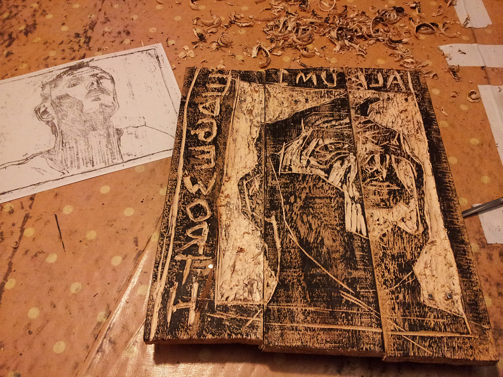 Edgeworth self-portrait inked wood carving