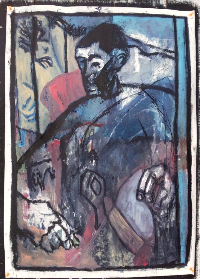 Man in an armchair with his back to the woods