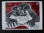 1/25 Self-portrait, crouched forward knelt down, black & red on white. Wood block print.